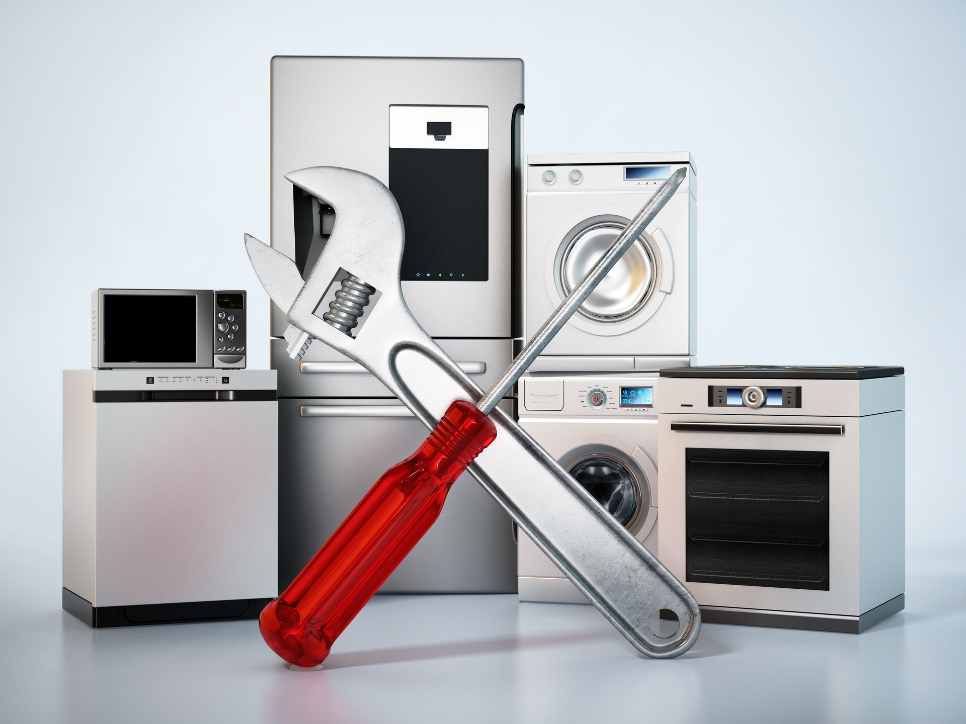Screwdriver and wrench standing in front of contemporary house appliances